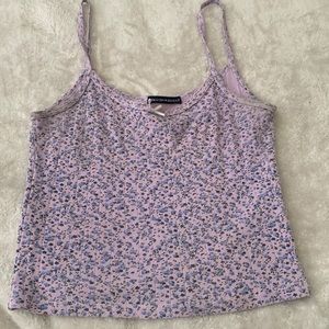 Brandy melville purple tank top, has tiny little blue flowers.